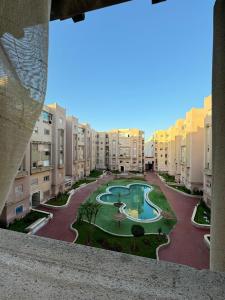 a view of an apartment complex from a window at Jardin mohammedia in Mohammedia
