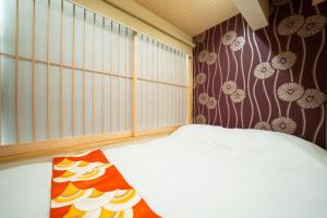 Postel nebo postele na pokoji v ubytování 久宿 東山 Hisaya Higashiyama Room A