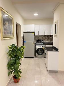 Una cocina o kitchenette en COMFY ZONe