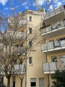 an apartment building with balconies on the side of it at ANER 5 elegantes Neustadt Apartment Abby in Dresden