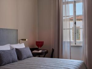 Postel nebo postele na pokoji v ubytování Amyth of Nicosia