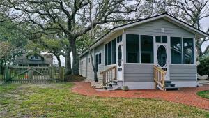 a small house with a porch and a fence at Mr, Bennie's Cafe home in Harkers Island