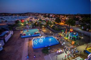 an aerial view of an amusement park at night at Mila in Vodnjan