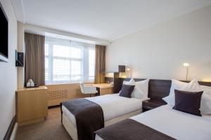 Postelja oz. postelje v sobi nastanitve Crowne Plaza Zürich by IHG