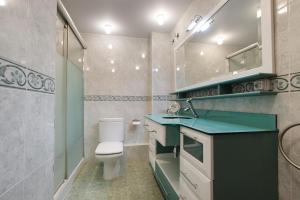 a bathroom with a toilet and a sink at Spacious Villa with Pool Plentzia Bilbao Area in Mendiondo +34 photos