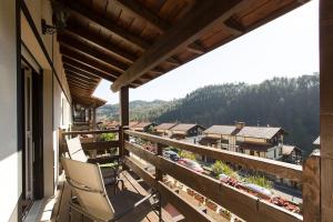 a balcony with a chair and a view of a town at Spacious Villa with Pool Plentzia Bilbao Area in Mendiondo