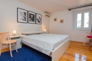 Postel nebo postele na pokoji v ubytování Apartments and Rooms Ille