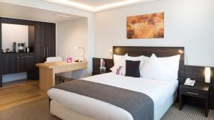 Postelja oz. postelje v sobi nastanitve Crowne Plaza Zürich by IHG