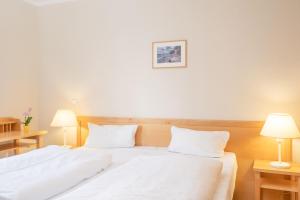 Postel nebo postele na pokoji v ubytování Fewo 630, Seepark Sellin