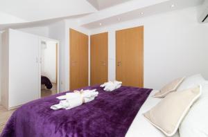Ein Bett oder Betten in einem Zimmer der Unterkunft Apartment Superb View 2