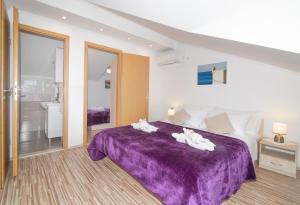 Ein Bett oder Betten in einem Zimmer der Unterkunft Apartment Superb View 2