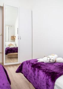 Ein Bett oder Betten in einem Zimmer der Unterkunft Apartment Superb View 2