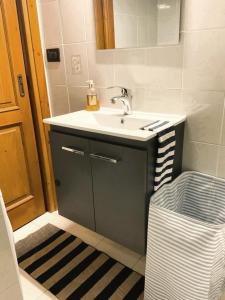 a bathroom with a sink and a mirror at Casa vacanza Donna Rosalia in Gaeta +18 photos