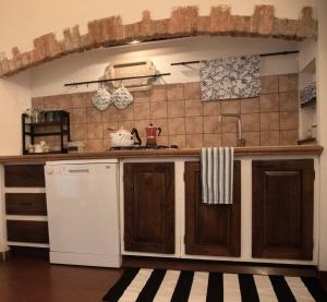 a kitchen with a sink and a counter top at Casa vacanza Donna Rosalia in Gaeta