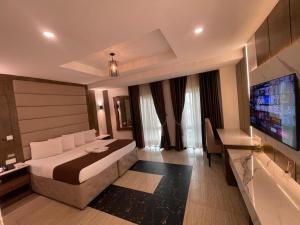A television and/or entertainment centre at Presken Hotel at International Airport Road
