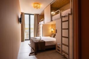 a bedroom with a bed and a bunk bed at The Loft House Sevilla in Seville