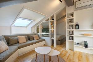 a living room with a couch and a table at Casa Giacomo in Arona +15 photos