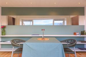 a dining room with a table and two chairs at Casa Giacomo in Arona