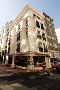 a large white building on a city street at Vertu istanbul in Istanbul