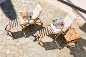 an overhead view of two lawn chairs on a patio at Sun Drop 2 with mini pool, 5-min walk to Drios beach in Drios