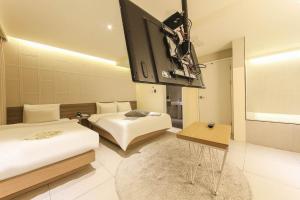 Postel nebo postele na pokoji v ubytování Hotel Yaja Sasang Terminal