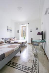 A bed or beds in a room at C&Y Apartments - Roma Prati - Luxury Double Studio with Kitchen
