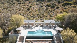 an aerial view of a house with a swimming pool at Sanbona Wildlife Reserve in Barrydale