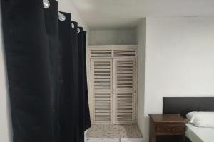 Postel nebo postele na pokoji v ubytování OYO Hotel Colibri