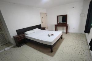 Postel nebo postele na pokoji v ubytování OYO Hotel Colibri