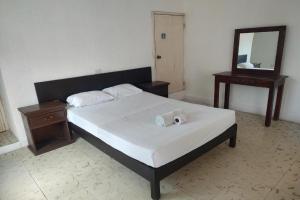 Postel nebo postele na pokoji v ubytování OYO Hotel Colibri