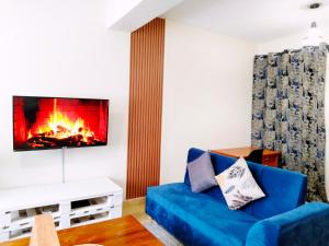 TV a/nebo společenská místnost v ubytování Nanyuki Cozy Haven