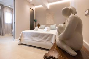 Posteľ alebo postele v izbe v ubytovaní Boutique Terrazza Aurea