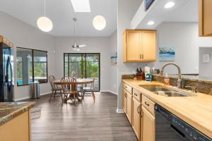 a kitchen with a table and a dining room at Candida's Retreat in Spring Hill