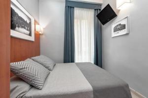Postel nebo postele na pokoji v ubytování Reyes Suite & Rooms