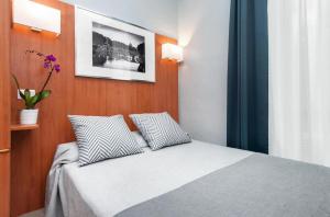 Postel nebo postele na pokoji v ubytování Reyes Suite & Rooms