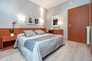 Postel nebo postele na pokoji v ubytování Reyes Suite & Rooms