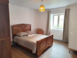 Postel nebo postele na pokoji v ubytování Gîte de groupe "chez le Dragou"