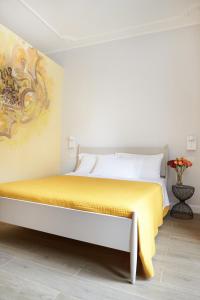 Postel nebo postele na pokoji v ubytování Reyes Suite & Rooms