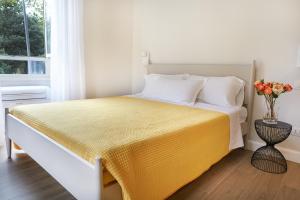 Postel nebo postele na pokoji v ubytování Reyes Suite & Rooms