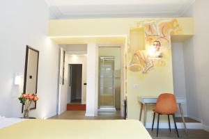 Postel nebo postele na pokoji v ubytování Reyes Suite & Rooms