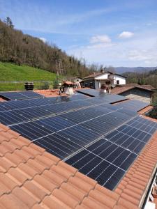 a roof with solar panels on top of a house at La Casina di Sotto in Castelnuovo di Garfagnana