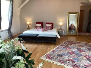 Postel nebo postele na pokoji v ubytování Au Château