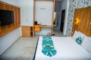 Hotel Yatchenin Abidjan客房内的一张或多张床位