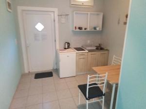 Kuchyň nebo kuchyňský kout v ubytování Apartment Lea
