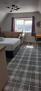 Postel nebo postele na pokoji v ubytování Bodalwyn Guest House