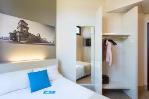 Postel nebo postele na pokoji v ubytování B&B Hotel Ferrara