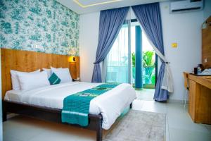 Hotel Yatchenin Abidjan客房内的一张或多张床位