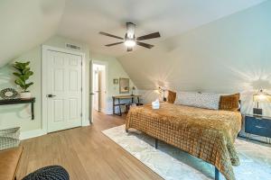 a bedroom with a bed and a ceiling fan at Lovely Secluded Cabin Surrounded by Trees in Clarkesville, Georgia in Aerial