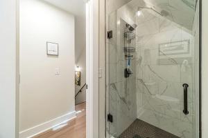 a bathroom with a shower with a glass door at Lovely Secluded Cabin Surrounded by Trees in Clarkesville, Georgia in Aerial +42 photos