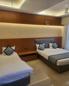 Voodi või voodid majutusasutuse Hotel Sai D-lax toas